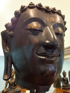 Buddha face in a historical museum, where we prayed.
