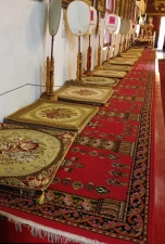 A line of mats inside the temple building.