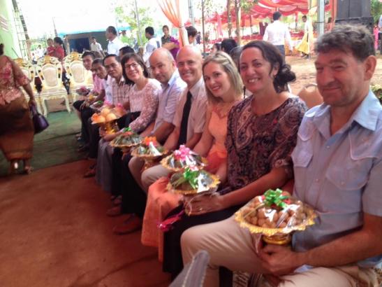 The lineup of fruit holders! The bride and groom are honored with gifts of fruit. My two new Kiwi friends Chris and Dave are on the end. Rob is 5th from the right. These are the three I will be working with to get clean water to the village.